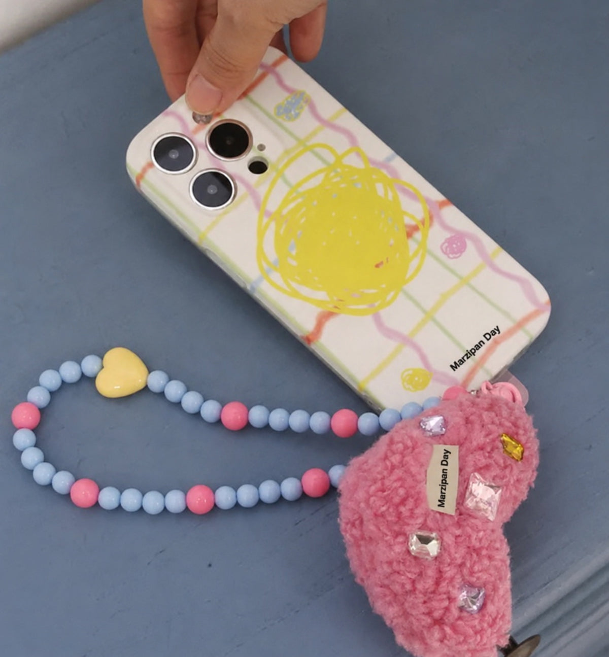 Berry Heart Phone Wrist Strap — Marzipan Day lifestyle view
